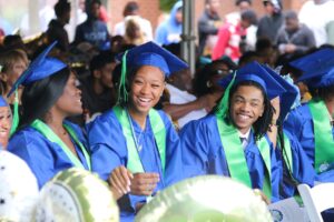 Graduates (L to R) Juliauna Warren, Cashimere Ralph, and Myuri Northern-Young celebrating at Nazareth Prep's graduation ceremony on June 7, 2024.