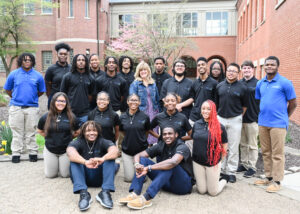 Members of the Class of 2024 with their class advisor, Mrs. Peggy Hill (center).