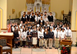 Sister Linda celebrating Christmas in the Holy Family Chapel with the first class of Nazareth Prep students.